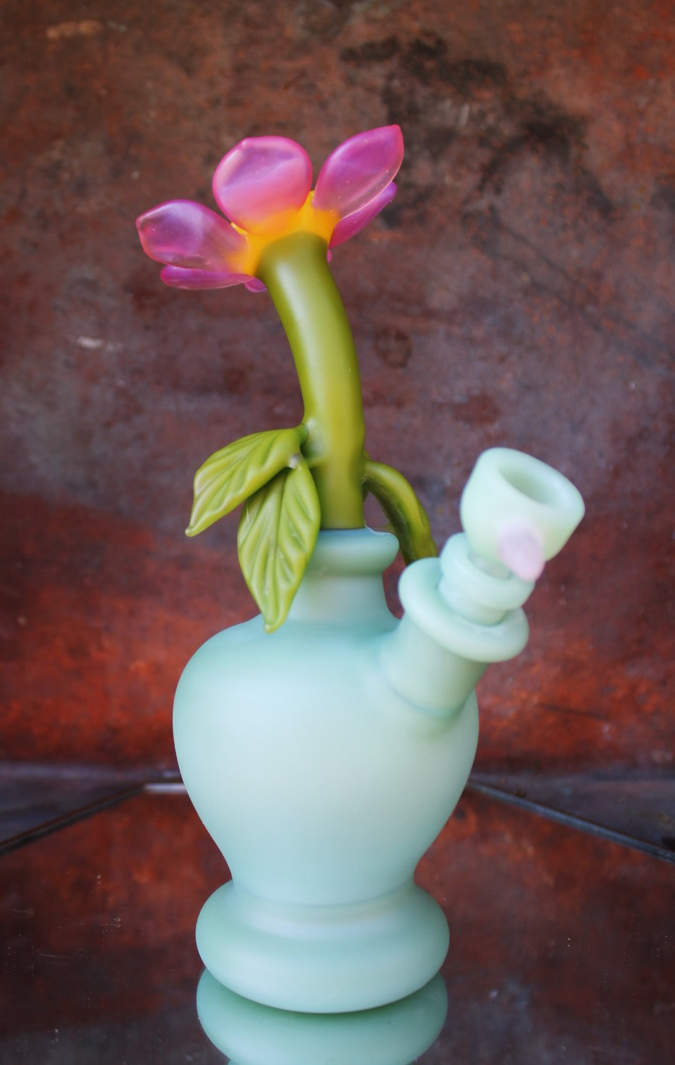 Pink bloom in mint bud vase